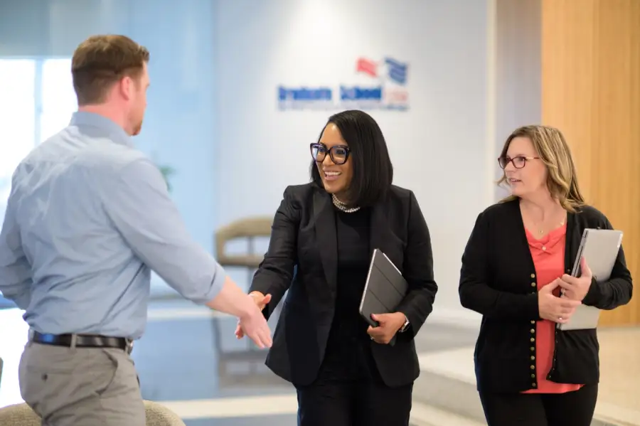 Federal colleagues greeting each other at Graduate School USA